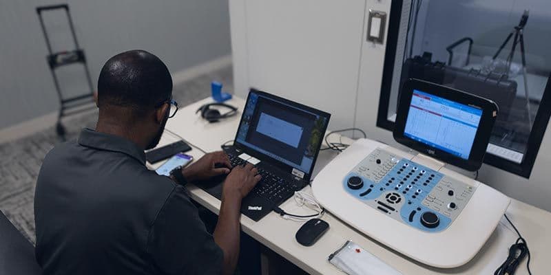 Technician calibrating a device