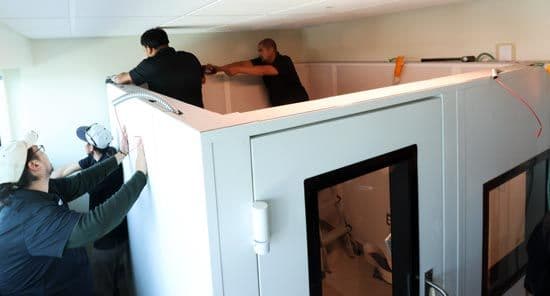 e3 Diagnostics booth installers completing a sound booth